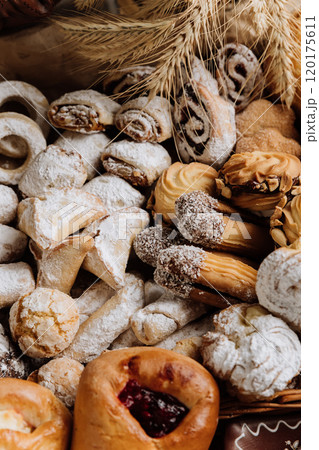 Assorted traditional pastries with powdered sugar and decorative details, perfect for dessert lovers 120175611