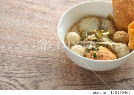 boiled Hakka meatball made from chop pork stuffing fried tofu with bean sprout and fish ball  topping crispy dumpling in spicy tom yum soup on bowl 120176462