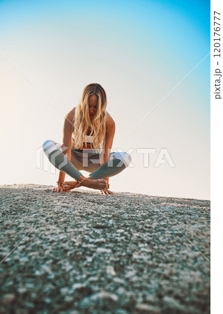 Be a better you, for you. Shot of an athletic young woman practicing yoga on the beach. Be a better you, for you. Shot of an athletic young woman practicing yoga on the beach. 120176777