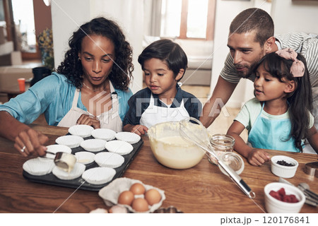 Go home and love your family. Shot of a young couple baking at home with their two children. Go home and love your family. Shot of a young couple baking at home with their two children. 120176841