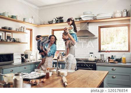 The secret ingredient in baking is always love. Shot of a young family spending quality time together in the kitchen at home. The secret ingredient in baking is always love. Shot of a young family spending quality time together in the kitchen at home. 120176854