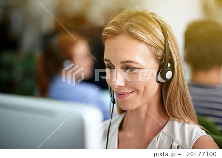 Directing calls with a smile. Cropped shot of a young businesswoman wearing a headset. 120177100