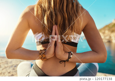 Yoga makes me reach places Ive never reached before. Rearview shot of a young woman practicing yoga on the beach. Yoga makes me reach places Ive never reached before. Rearview shot of a young woman practicing yoga on the beach. 120177138