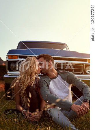 Youll always be the one of my dreams. Shot of an affectionate young couple enjoying a roadtrip together. 120177294