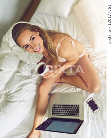 Me time is a must in my schedule. Portrait of a young woman using a laptop in her underwear during the morning. Me time is a must in my schedule. Portrait of a young woman using a laptop in her underwear during the morning. 120177361