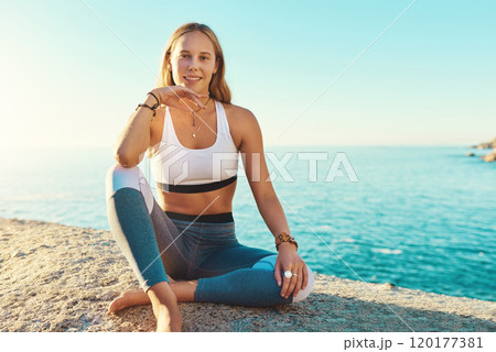 Yoga is my happy place. Portrait of a beautiful young woman sitting on the beach for her yoga session. Yoga is my happy place. Portrait of a beautiful young woman sitting on the beach for her yoga session. 120177381