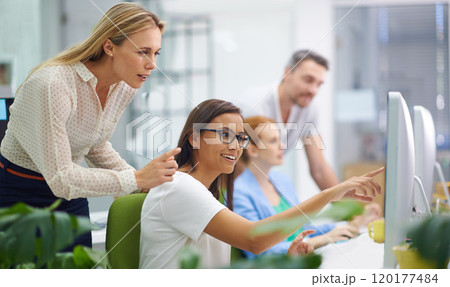 How amazing is this. Shot of an attractive female showing her boss something on her computer screen. 120177484