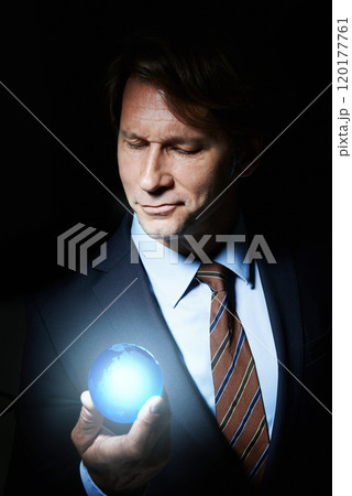 Globe, business man and hologram for networking, communication or globalization in studio with black background. World, innovation and male person for connection, development and information Globe, business man and hologram for networking, communication or globalization in studio with black background. World, innovation and male person for connection, development and information 120177761