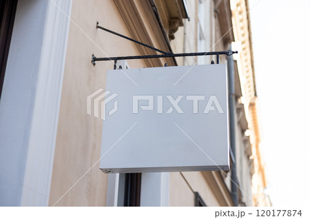 Street storefront shop, cafe, restaurant mounted signboard mock up design template. Blank white store sign design mockup. 120177874