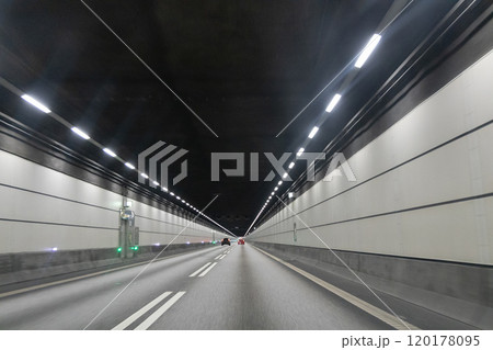 High-speed road tunnel view from a fast-moving car. 120178095