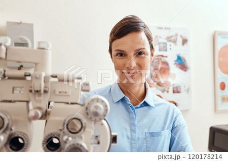 Im keeping my eyes on yours. Portrait of a confident woman using an optical refractor in an optometrists office. 120178214