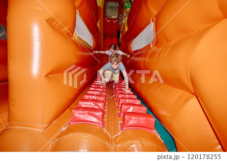 Kids climbing soft orange leather tunnel 120178255