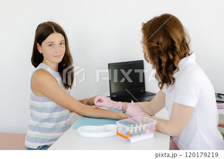 Doctor doing skin allergy test at white table in office. Allergy test - skin prick allergy testing for possible allergens 120179219