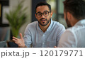 Young professional man having an enthusiastic conversation with a colleague 120179771