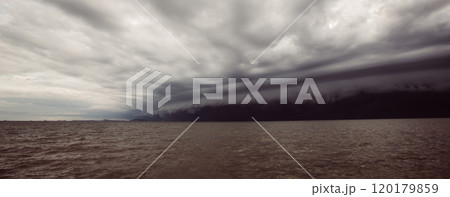 Cloudy storm in the sea before rainy.tornado storms cloud above the sea. Monsoon season. Storm in the sea.Wonder of natural disaster.Cloud before rain,Sky before the storm.use for background wallpaper 120179859