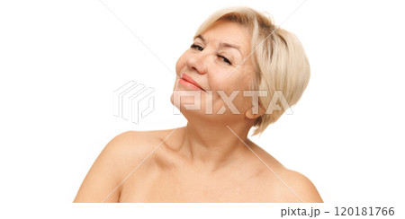 Mature woman with cheerful, light smile and clear complexion representing graceful approach to self-care against white studio background. Mature woman with cheerful, light smile and clear complexion representing graceful approach to self-care against white studio background. 120181766