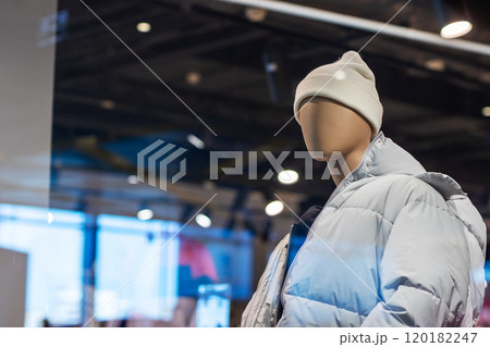 A mannequin is dressed in a stylish white hat and a light blue jacket A mannequin is dressed in a stylish white hat and a light blue jacket 120182247