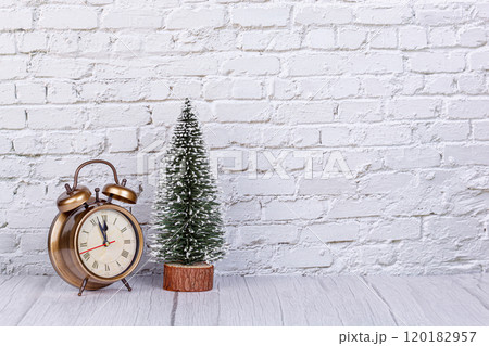 alarm clock, Christmas tree, gifts Christmas toys on the background of a brick wall alarm clock, Christmas tree, gifts Christmas toys on the background of a brick wall 120182957