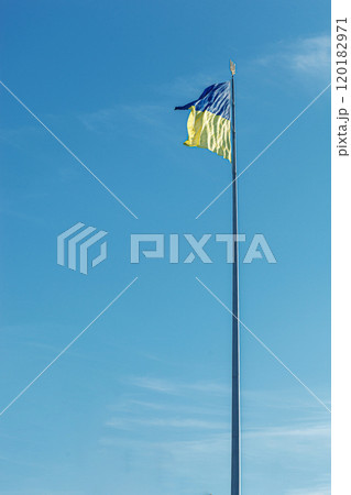Ukrainian flag against the blue sky 120182971