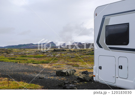 Icelandic nature landscape with camper van on gravel road 120183030