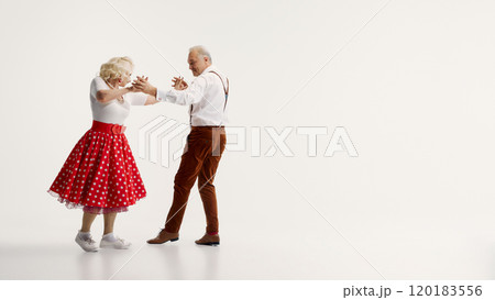 Elderly couple enjoying swing dancing, showcasing vibrant moves and joyful expressions, isolated on white background Elderly couple enjoying swing dancing, showcasing vibrant moves and joyful expressions, isolated on white background 120183556