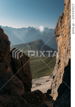 Experience the Stunning and Majestic View of the Dolomites Mountains as Seen Through Rocky and Rugged Terrain 120183817