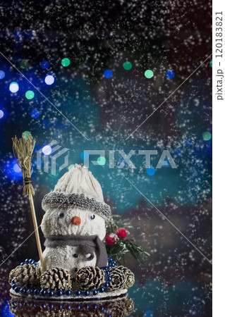 Christmas card. New Year background with snowman bokeh and garland. Greeting card. Toy snowman 120183821