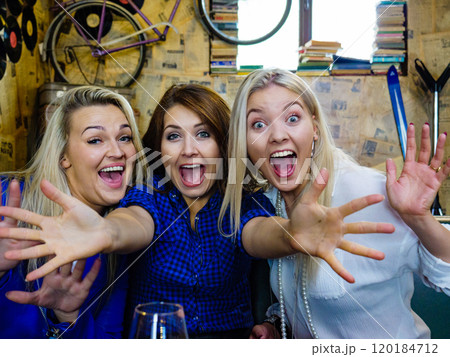 Happy girls in pub club having fun 120184712