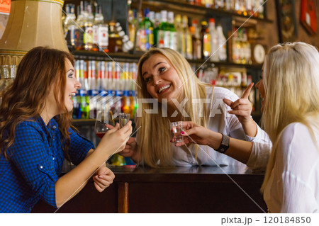 Girls in pub club gossiping and talking Girls in pub club gossiping and talking 120184850
