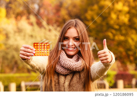 Woman with vitamins for autumn. Woman with vitamins for autumn. 120186095
