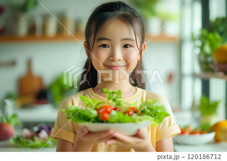 Asian girl eating salad, healthy eating concept 120186712