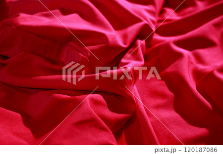 Elite bedclothes. Red wrinkled fabric texture background  120187086