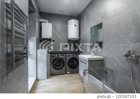 Modern furnished bathroom dark grey interior design with granite tiles 120187183