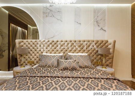Luxury Interior Primary Bedroom Detail of Headboard and Bedding. Luxury Interior Primary Bedroom Detail of Headboard and Bedding. 120187188
