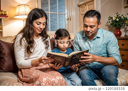 Christian family spending time in prayer and Bible reading.  120188338