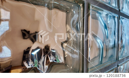 Textured Glass Blocks Creating a Distorted Indoor Reflection Textured Glass Blocks Creating a Distorted Indoor Reflection 120188736