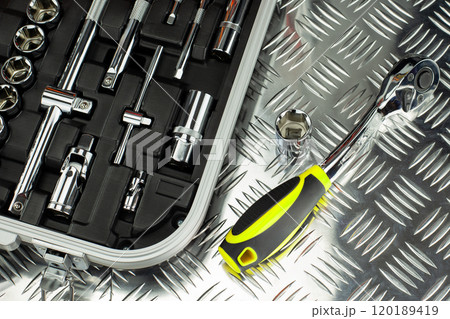 Socket Wrench Set with Tools on Metal Surface Socket Wrench Set with Tools on Metal Surface 120189419