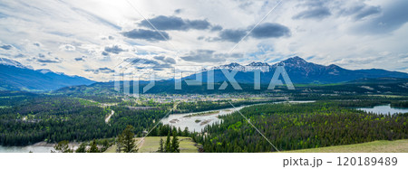 Looking over Town of Jasper, Athabasca River forest and Pyramid Mountain in summer. Panoramic view from Old fort point trailhead. Jasper National Park, Alberta, Canada. Canadian Rockies. 120189489