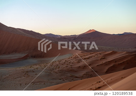 Climbing Dune 45 at sunrise Climbing Dune 45 at sunrise 120189538