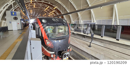 Light Rail Transit or LRT or rail transport system in Indonesia, modern metro train stationed at an urban platform, showcasing efficient public transport 120190209