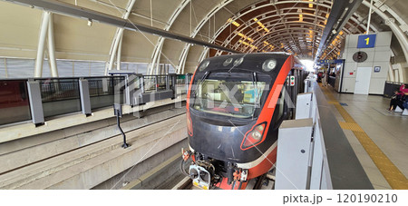 Light Rail Transit or LRT or rail transport system in Indonesia, modern metro train stationed at an urban platform, showcasing efficient public transport 120190210