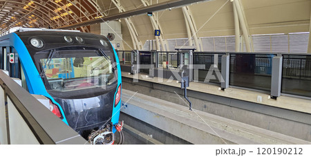 Light Rail Transit or LRT or rail transport system in Indonesia, modern metro train stationed at an urban platform, showcasing efficient public transport Light Rail Transit or LRT or rail transport system in Indonesia, modern metro train stationed at an urban platform, showcasing efficient public transport 120190212