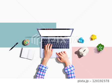 Laptop computer with a piggy bank and office objects Laptop computer with a piggy bank and office objects 120192378