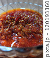 Super spicy red shrimp paste chili sauce on a clear bowl 120193360