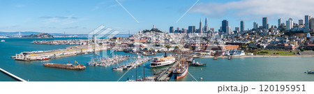 Panoramic aerial view of San Francisco featuring the Transamerica Pyramid, Salesforce Tower, Bay Bridge, and historic Hyde Street Pier on a clear day. 120195951