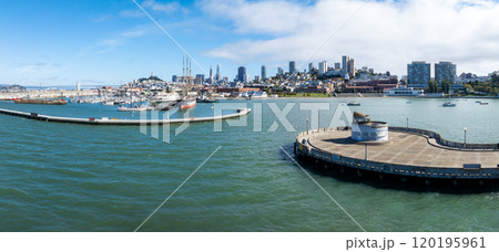 Aerial view of San Francisco's skyline featuring the Transamerica Pyramid and Salesforce Tower, with a waterfront and boats in the foreground. Aerial view of San Francisco's skyline featuring the Transamerica Pyramid and Salesforce Tower, with a waterfront and boats in the foreground. 120195961