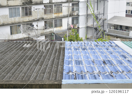 tile roof on top of old building in city tile roof on top of old building in city 120196117