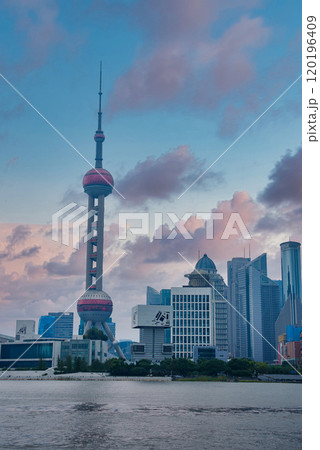 View of Shanghai's skyline featuring the Oriental Pearl Tower, Shanghai World Financial Center, and Jin Mao Tower across the Huangpu River. View of Shanghai's skyline featuring the Oriental Pearl Tower, Shanghai World Financial Center, and Jin Mao Tower across the Huangpu River. 120196409
