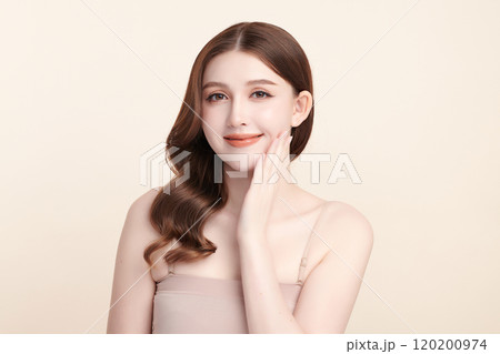 Beautiful young asian woman with clean fresh skin on beige background, Face care, Facial treatment, Cosmetology, beauty and spa, Asian women portrait. Beautiful young asian woman with clean fresh skin on beige background, Face care, Facial treatment, Cosmetology, beauty and spa, Asian women portrait. 120200974
