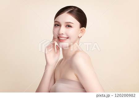 Beautiful young asian woman with clean fresh skin on beige background, Face care, Facial treatment, Cosmetology, beauty and spa, Asian women portrait. 120200982